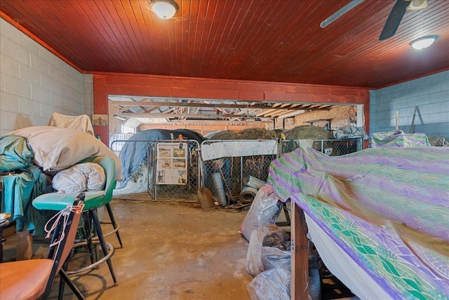 103 E 1400 N Rd, Danvers, IL 61732 - miscellaneous room featuring unfinished concrete flooring, concrete block wall, wood ceiling, and ceiling fan