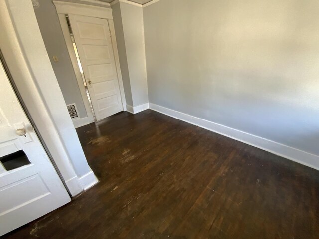405 Chandler St, Danville, IL 61832 - spare room featuring baseboards, visible vents, and wood finished floors