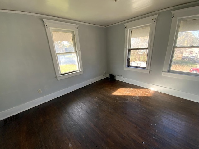 405 Chandler St, Danville, IL 61832 - unfurnished room featuring dark wood-style flooring, crown molding, and baseboards