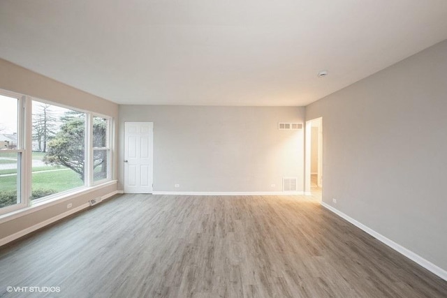 270 W 10th St, Chicago Heights, IL 60411 - spare room with wood finished floors, baseboards, and visible vents
