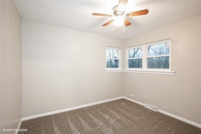 270 W 10th St, Chicago Heights, IL 60411 - empty room with baseboards, ceiling fan, visible vents, and dark colored carpet