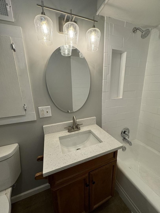 full bathroom with toilet, vanity, shower / bath combination, and baseboards