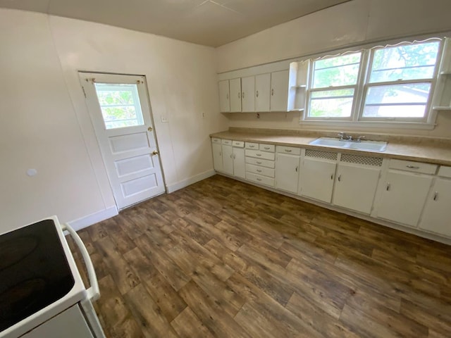 716 Robinson St, Danville, IL 61832 - kitchen featuring light countertops, a sink, white cabinetry, white range with electric stovetop, and dark wood-style flooring