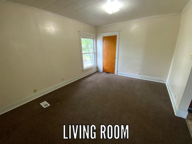 716 Robinson St, Danville, IL 61832 - unfurnished room featuring baseboards, visible vents, crown molding, and carpet flooring