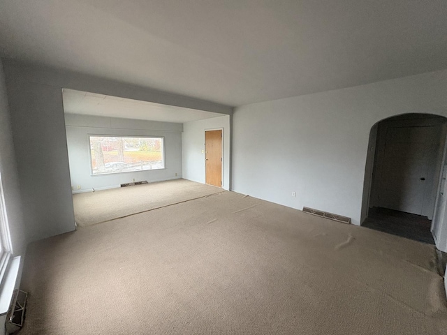 716 Robinson St, Danville, IL 61832 - carpeted spare room featuring arched walkways and visible vents