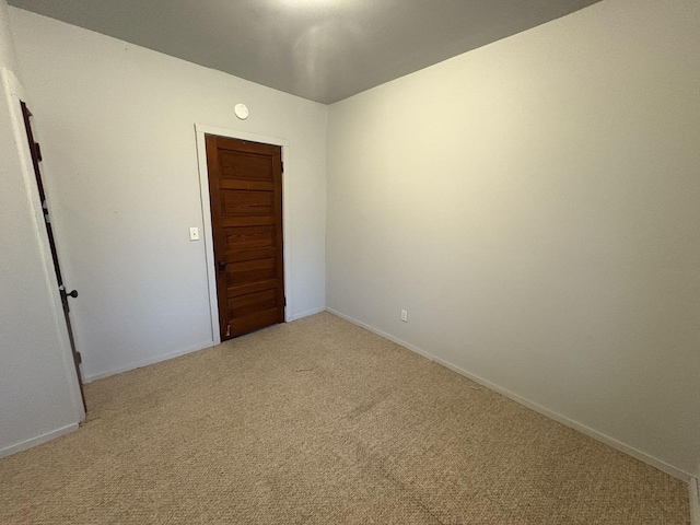 716 Robinson St, Danville, IL 61832 - unfurnished room with light colored carpet and baseboards