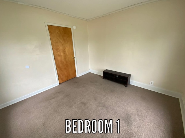 716 Robinson St, Danville, IL 61832 - empty room with carpet floors and baseboards