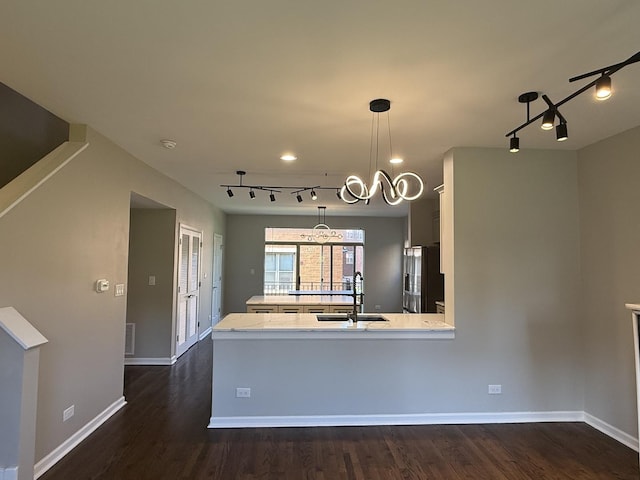 1333 N Burling St Unit B, Chicago, IL 60610 - kitchen with track lighting, stainless steel fridge, dark wood-type flooring, a center island, and pendant lighting