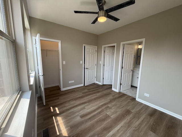 1333 N Burling St Unit B, Chicago, IL 60610 - unfurnished bedroom with wood finished floors, baseboards, and ensuite bath