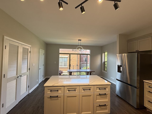 1333 N Burling St Unit B, Chicago, IL 60610 - kitchen with stainless steel fridge, dark wood finished floors, and light stone counters