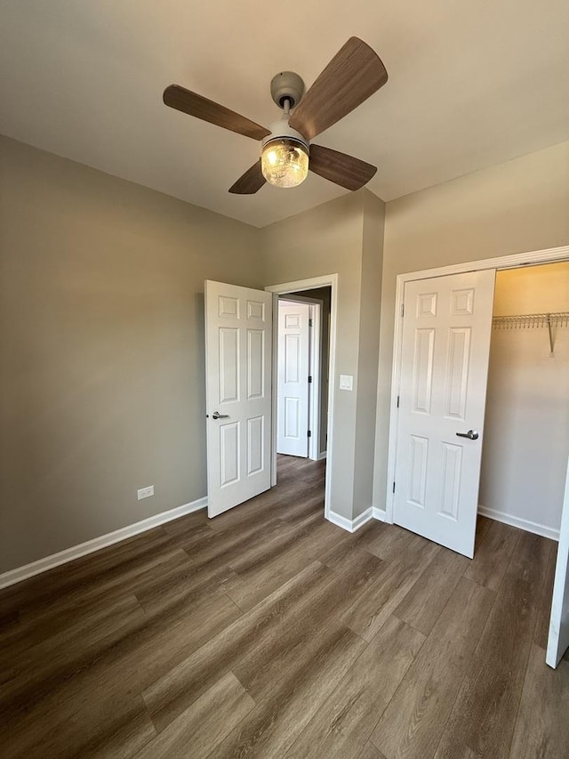 1333 N Burling St Unit B, Chicago, IL 60610 - unfurnished bedroom with dark wood-type flooring, baseboards, a closet, and a ceiling fan