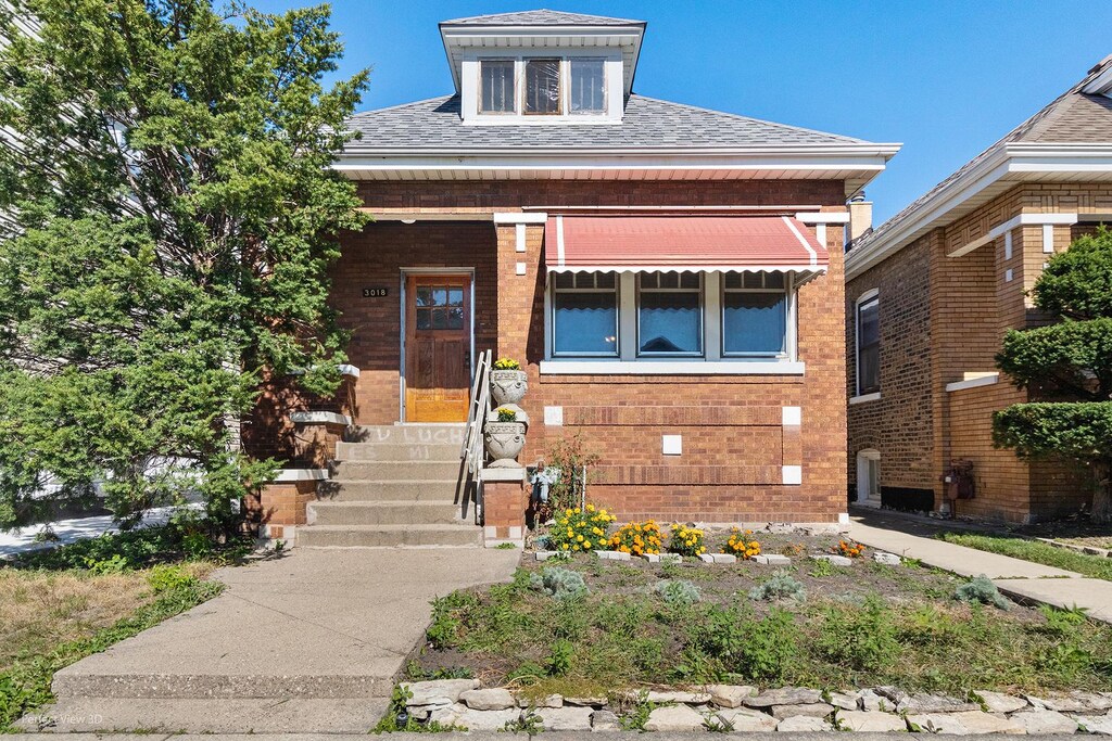 3018 W 54th St, Chicago, IL 60632 - view of front of house with entry steps and a shingled roof