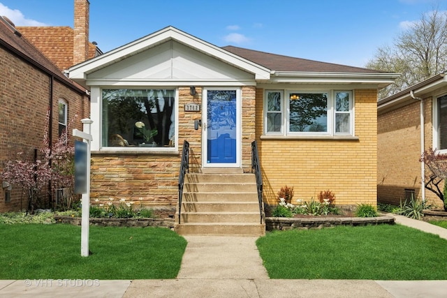 3762 N Odell Ave, Chicago, IL 60634 - bungalow-style home with brick siding, a front yard, and entry steps