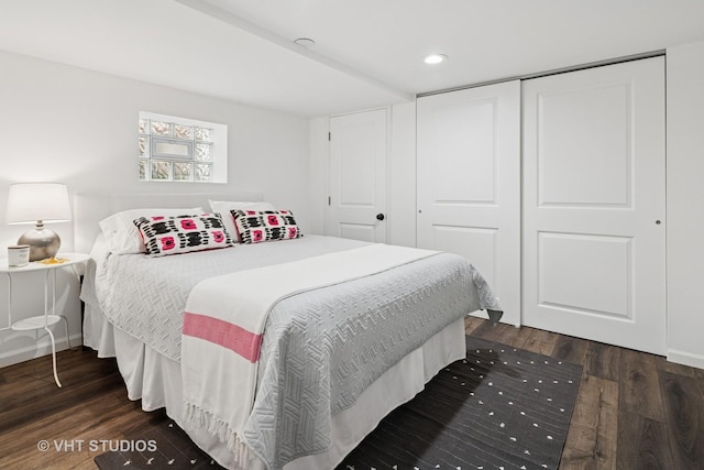 3762 N Odell Ave, Chicago, IL 60634 - bedroom with dark wood-type flooring, recessed lighting, and a closet