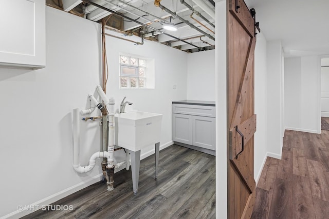 3762 N Odell Ave, Chicago, IL 60634 - basement featuring baseboards and dark wood-style floors