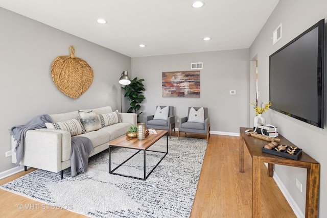 3762 N Odell Ave, Chicago, IL 60634 - living area with recessed lighting, visible vents, and wood finished floors
