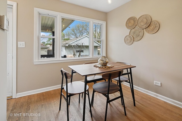 3762 N Odell Ave, Chicago, IL 60634 - dining space featuring baseboards and wood finished floors