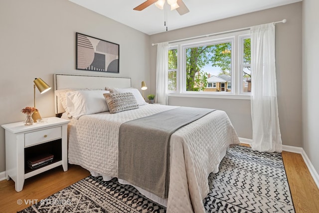 3762 N Odell Ave, Chicago, IL 60634 - bedroom featuring baseboards, ceiling fan, and wood finished floors