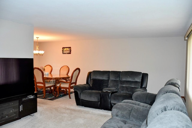 living room with light colored carpet and a notable chandelier