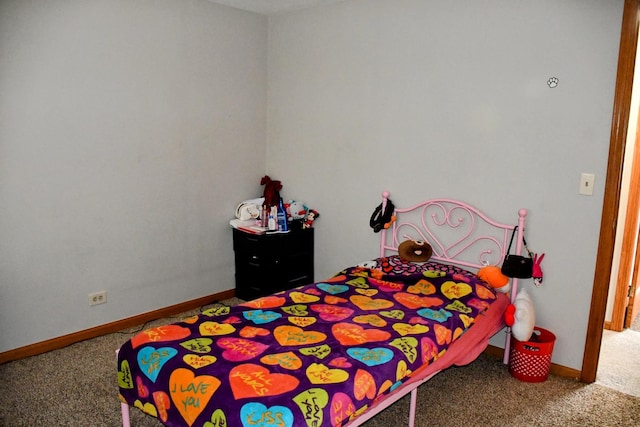 carpeted bedroom with baseboards