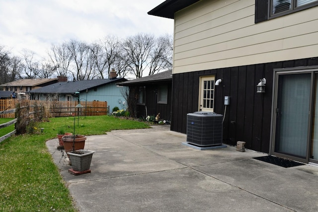 view of patio / terrace with fence and central AC