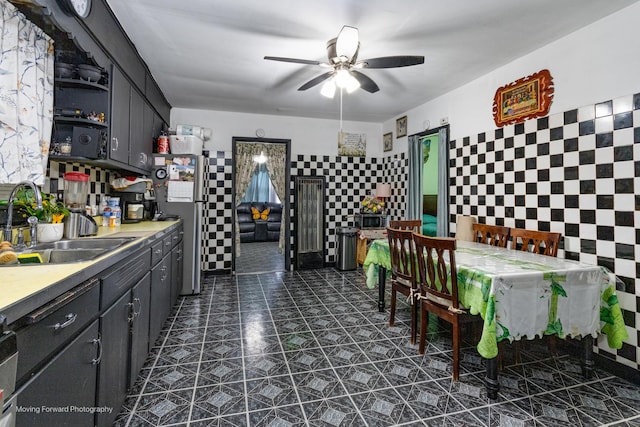 3041 S Drake Ave, Chicago, IL 60623 - interior space featuring light countertops, a sink, open shelves, ceiling fan, and dark tile patterned flooring