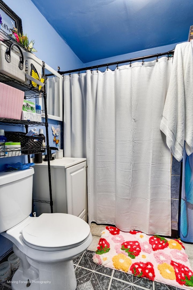 3041 S Drake Ave, Chicago, IL 60623 - bathroom with tile patterned floors, a shower with shower curtain, and toilet