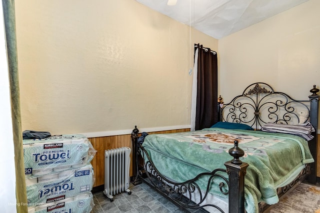 3041 S Drake Ave, Chicago, IL 60623 - bedroom featuring radiator heating unit, wooden walls, and wainscoting