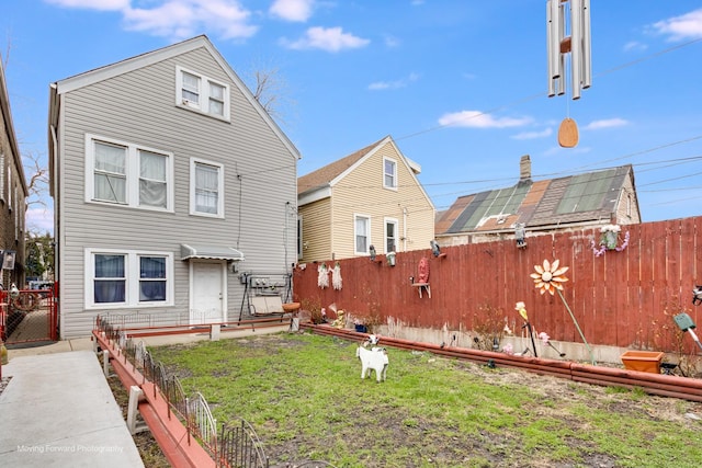 3041 S Drake Ave, Chicago, IL 60623 - rear view of property with a fenced backyard