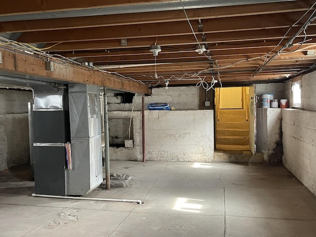 below grade area featuring heating unit