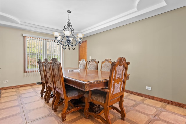 3315 E Bemes Rd, Crete, IL 60417 - dining area featuring a chandelier, a raised ceiling, and baseboards