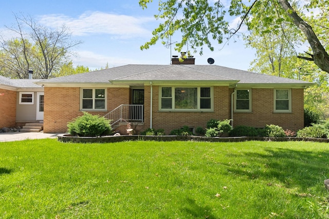 3315 E Bemes Rd, Crete, IL 60417 - ranch-style home with a chimney, brick siding, and a front lawn