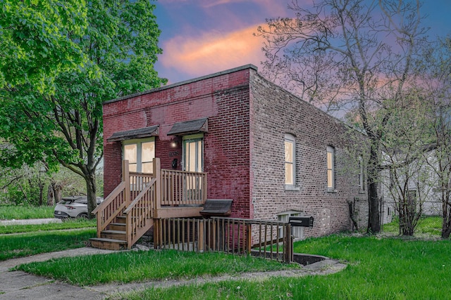 view of front of home featuring brick siding