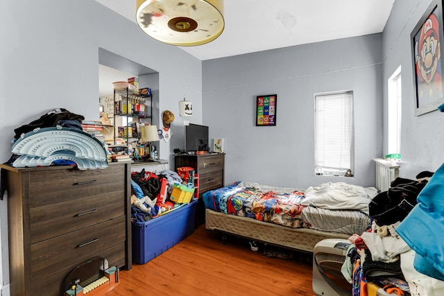 bedroom featuring light wood-style flooring