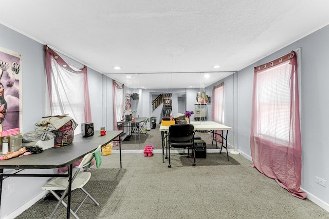 carpeted office with recessed lighting, baseboards, and a textured ceiling