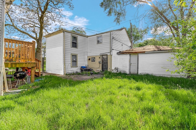 back of house with a wooden deck