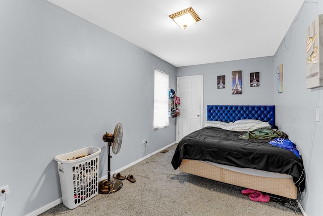 carpeted bedroom featuring baseboards