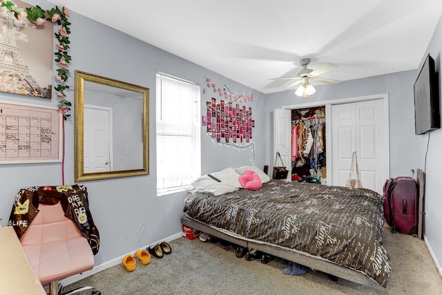 carpeted bedroom with baseboards, a closet, and a ceiling fan
