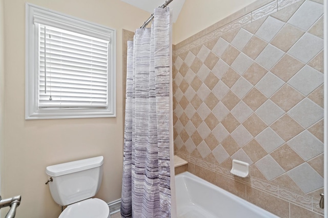 bathroom featuring toilet and shower / bath combo with shower curtain