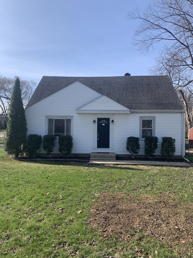 26W441 Geneva Rd, Wheaton, IL 60187 - view of front of house with roof with shingles and a front lawn