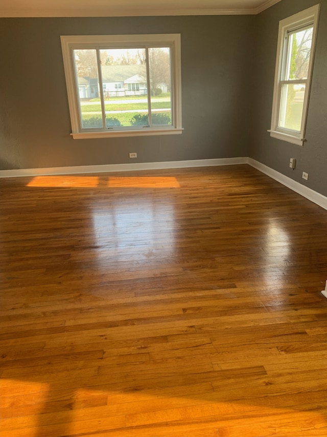 26W441 Geneva Rd, Wheaton, IL 60187 - unfurnished room featuring ornamental molding, wood finished floors, and baseboards