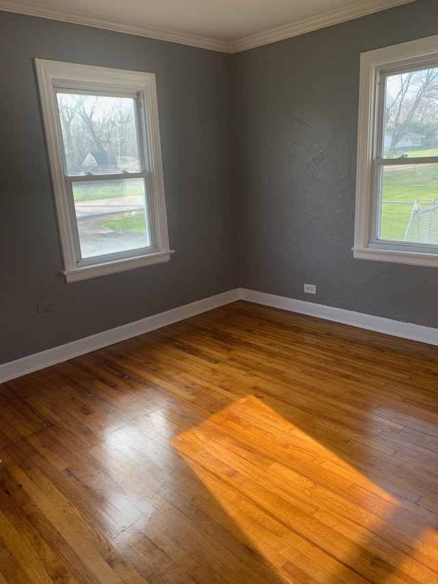 26W441 Geneva Rd, Wheaton, IL 60187 - spare room with hardwood / wood-style floors, crown molding, and baseboards