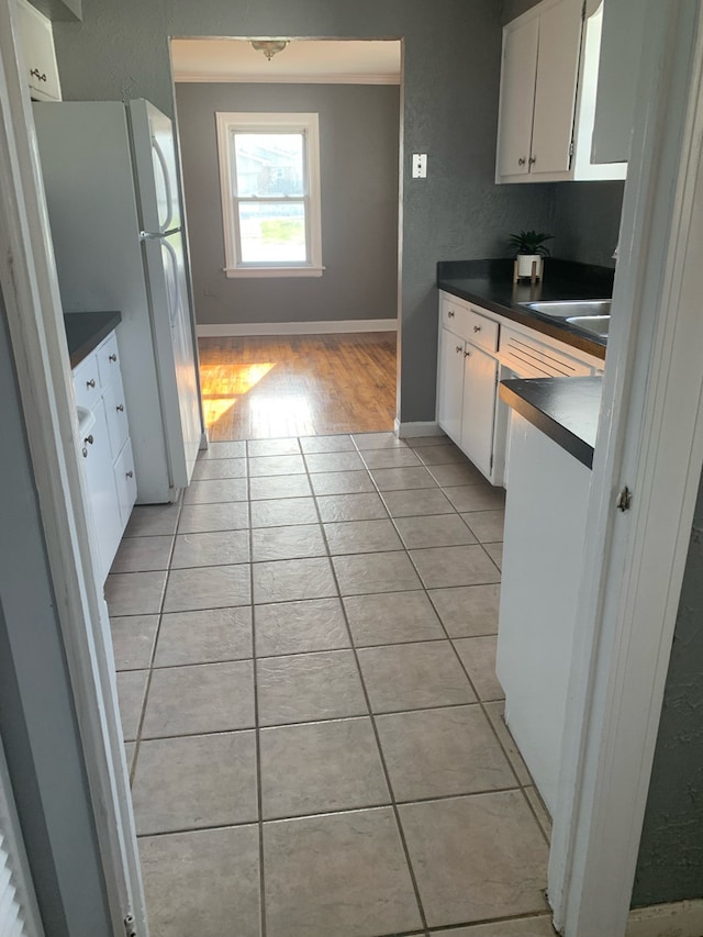 26W441 Geneva Rd, Wheaton, IL 60187 - kitchen with white cabinetry, light tile patterned floors, and dark countertops