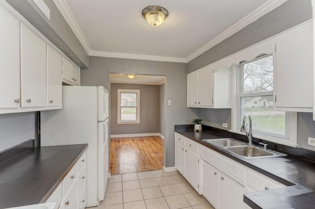 26W441 Geneva Rd, Wheaton, IL 60187 - kitchen featuring freestanding refrigerator, dark countertops, a healthy amount of sunlight, and a sink