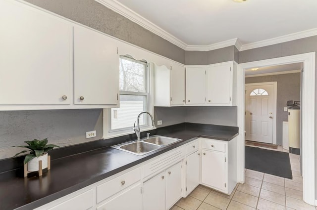26W441 Geneva Rd, Wheaton, IL 60187 - kitchen with white cabinetry, a sink, dark countertops, light tile patterned flooring, and ornamental molding