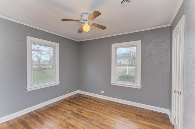 26W441 Geneva Rd, Wheaton, IL 60187 - unfurnished room featuring a wealth of natural light, visible vents, and wood finished floors
