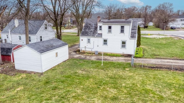 26W441 Geneva Rd, Wheaton, IL 60187 - view of home's exterior with a residential view, a yard, a chimney, roof with shingles, and fence
