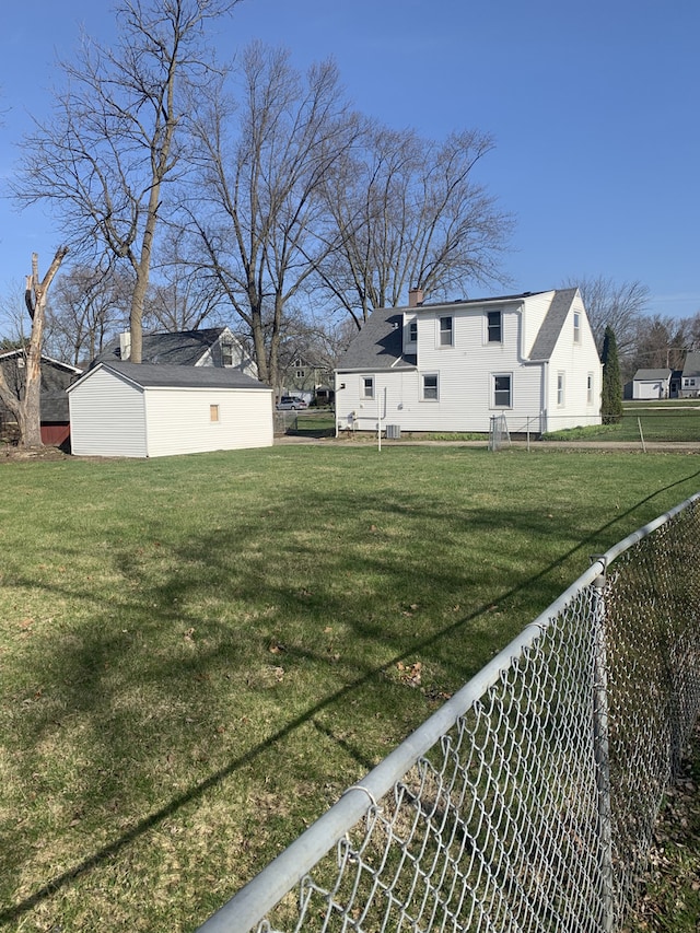 26W441 Geneva Rd, Wheaton, IL 60187 - view of yard featuring fence and an outdoor structure