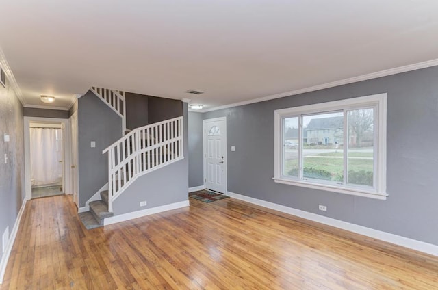 26W441 Geneva Rd, Wheaton, IL 60187 - unfurnished living room with visible vents, baseboards, ornamental molding, wood finished floors, and stairs