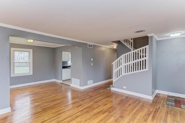 26W441 Geneva Rd, Wheaton, IL 60187 - unfurnished living room with visible vents, stairs, and light wood-style floors